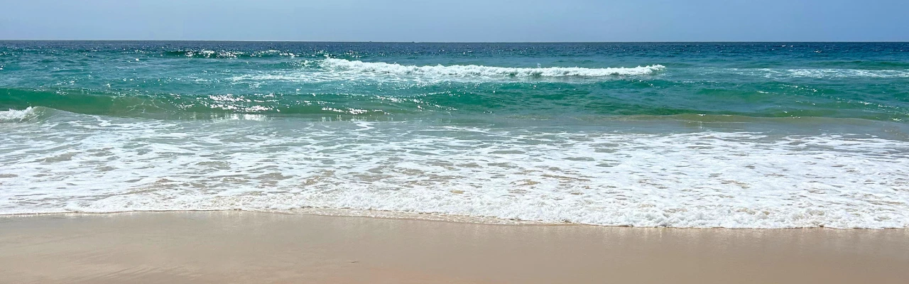 A wave crashing on Surf Beach in Narooma, NSW.